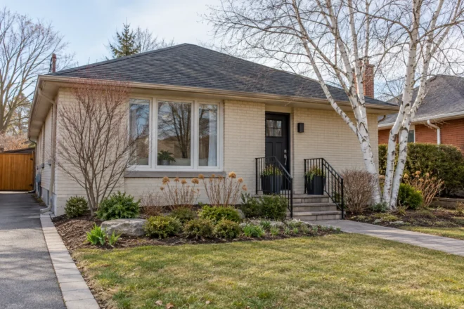 Bungalow front garden during early spring cleanup