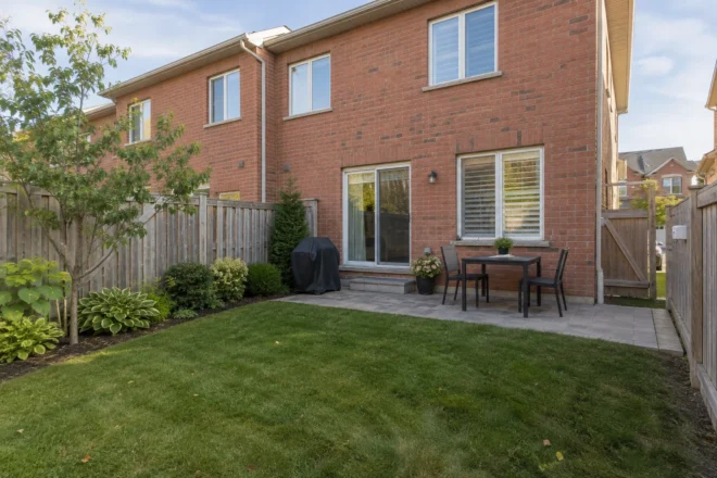 Townhouse lawn and shallow route beside a board fence