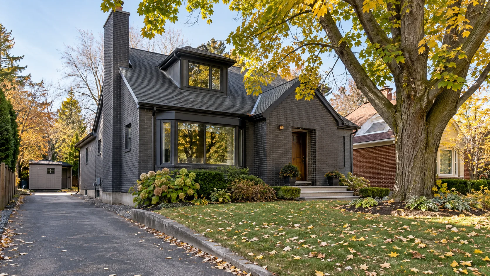 Residential front and side property showing grade, access and mature tree context
